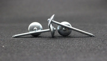 Zinc or asbestos nails. Made of iron with a round head resembling an umbrella. Often called tacks.の写真素材