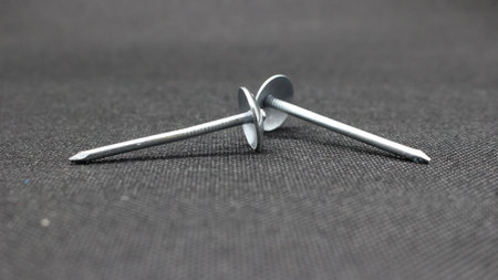 Zinc or asbestos nails. Made of iron with a round head resembling an umbrella. Often called tacks.の写真素材
