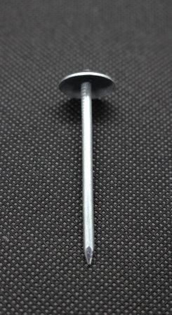 Zinc or asbestos nails. Made of iron with a round head resembling an umbrella. Often called tacks.の写真素材