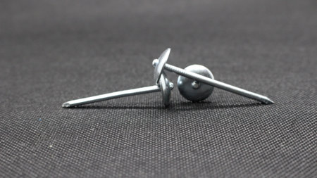 Zinc or asbestos nails. Made of iron with a round head resembling an umbrella. Often called tacks.の写真素材