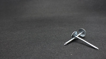 Zinc or asbestos nails. Made of iron with a round head resembling an umbrella. Often called tacks.の写真素材