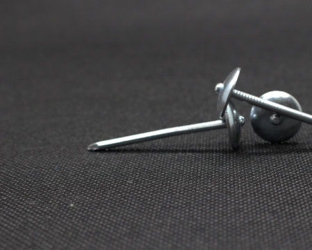 Zinc or asbestos nails. Made of iron with a round head resembling an umbrella. Often called tacks.の写真素材