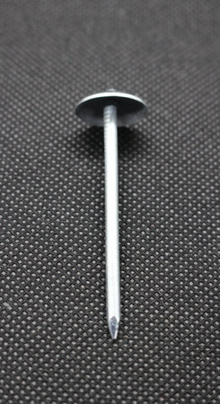 Zinc or asbestos nails. Made of iron with a round head resembling an umbrella. Often called tacks.の写真素材
