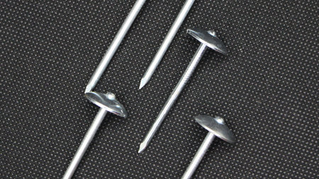Zinc or asbestos nails. Made of iron with a round head resembling an umbrella. Often called tacks.の写真素材