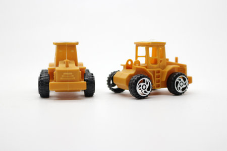 Two clean yellow toy trucks