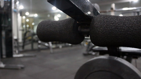 Sports equipment in a clean gym on a black backgroundの写真素材