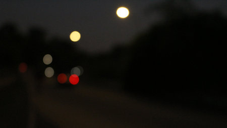 Circle lights with blur effect on night backgroundの写真素材