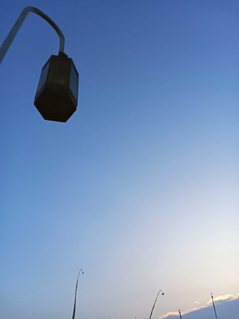 Street lamp with bright clouds in the morning