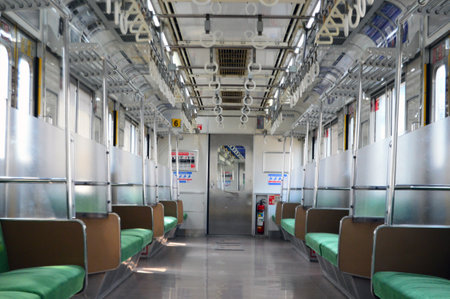 Interior Commuter Line or electric train in Jakarta, Indonesia. In the photo from the right angle,...