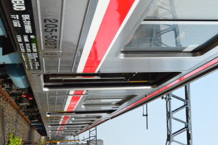 Commuter Line or electric train in Jakarta, Indonesia. In the photo from the right angle, which...