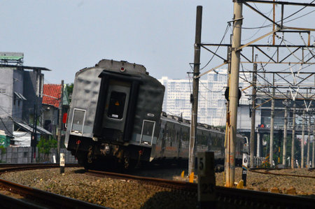 Commuter Line or electric train in Jakarta, Indonesia. In the photo from the right angle, which...