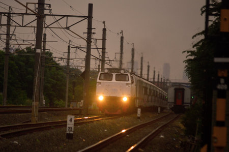 Commuter Line or electric train in Jakarta, Indonesia. In the photo from the right angle, which...