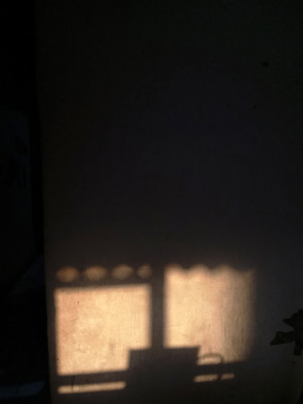 Photo of light coming in from the window of a house, it feels warm.