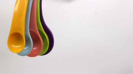 Measuring spoons in various colors. measuring spoons in many sizes and many colors.の写真素材