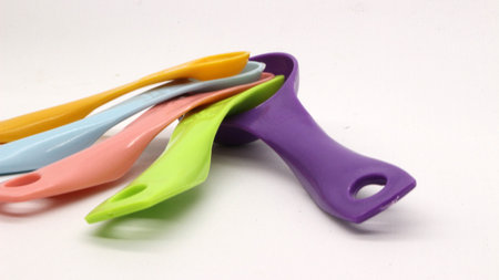 Measuring spoons in various colors. measuring spoons in many sizes and many colors.の写真素材