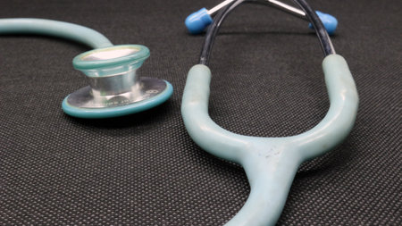 Close up of a blue Stethoscope on a black backgroundの写真素材