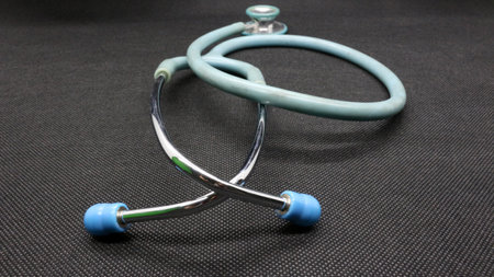 Close up of a blue Stethoscope on a black backgroundの写真素材