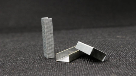 Stack of staples for stapler on black backgroundの写真素材