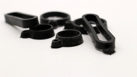 Black rubber band isolated on white backgroundの写真素材