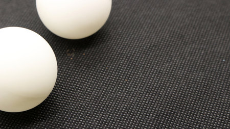 Ping pong ball isolated on black background
