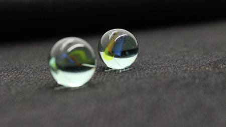 Marble toy isolated on black backgroundの写真素材