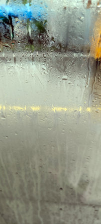 View of the highway from the foggy glass during the rain