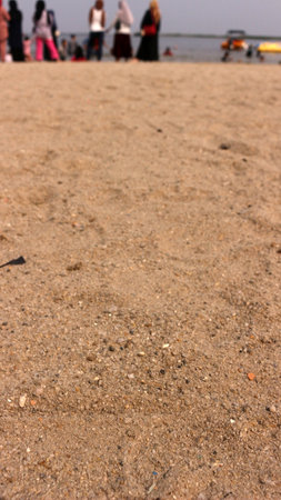 Beach sand and the sound of waves, natural and beautiful views on Ancol beach. with many visitorsの写真素材