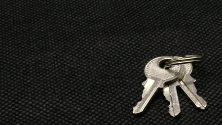 The key is silver with a black background. This key is small so it is unique.の写真素材