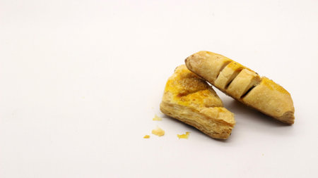 Chocolate pastry cake with a triangular shape, looks very delicious on a white background.の写真素材