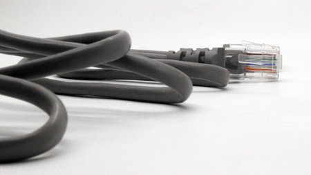 Black network cable isolated on white background