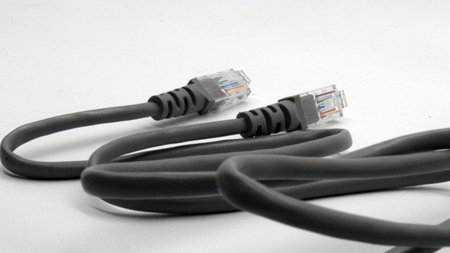 Black network cable isolated on white background