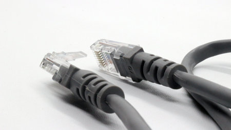 Black network cable isolated on white background