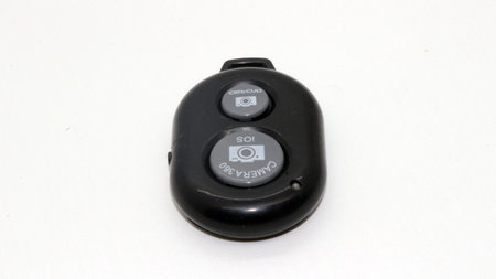 Bluetooth shutter remote for camera isolated on white background