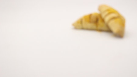 Chocolate pastry cake with a triangular shape, looks very delicious on a white background.