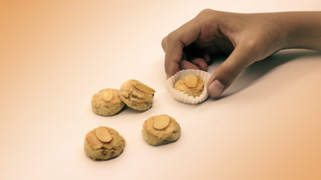 Peanut cake topped with cashew nuts, a typical Indonesian food and often served during Eid.の写真素材