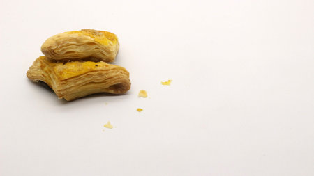 Chocolate pastry cake with a triangular shape, looks very delicious on a white background.の写真素材