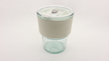 Tumbler in the form of a glass or glass mug with a modern design. Equipped with a beautiful lid and...