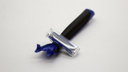Blue mustache and beard trimmer isolated on white background