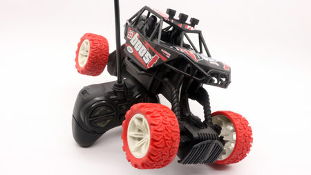 Remote control car toy, black and red jeep type.