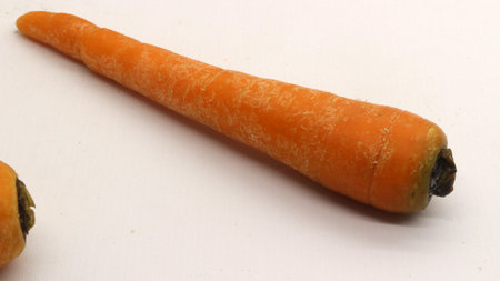 Fresh carrot isolated on white backgroundの写真素材
