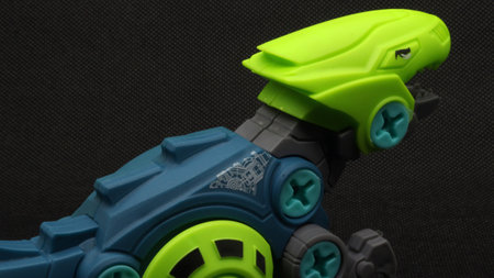 Dinosaur toy isolated on black backgroundの写真素材