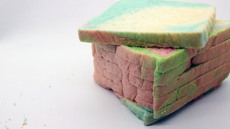 Sliced colorful bread isolated on white backgroundの写真素材