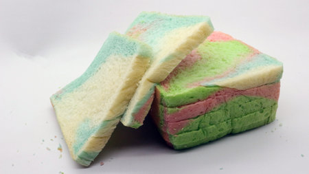 Sliced rainbow bread isolated on white backgroundの写真素材