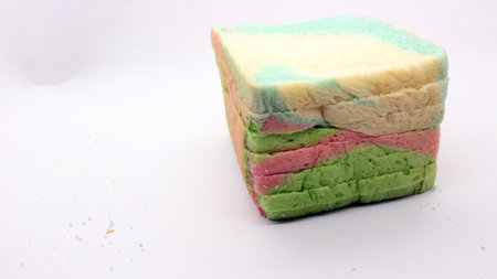 Sliced rainbow bread isolated on white backgroundの写真素材