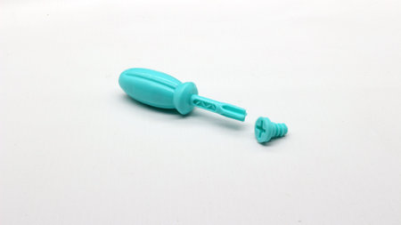 Blue screwdriver toy and nuts isolated on white backgroundの写真素材