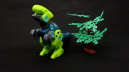 Dinosaur toy isolated on black backgroundの写真素材