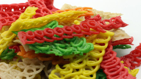 Colorful crackers or krupuk isolated on white backgroundの写真素材