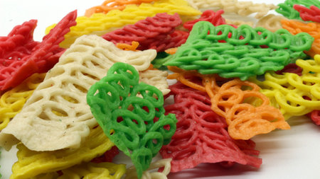 Colorful crackers or krupuk unfried isolated on white backgroundの写真素材