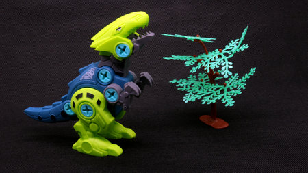 Dinosaur toy isolated on black backgroundの写真素材