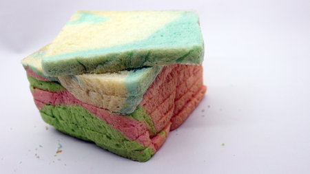 Sliced colorful bread isolated on white backgroundの写真素材